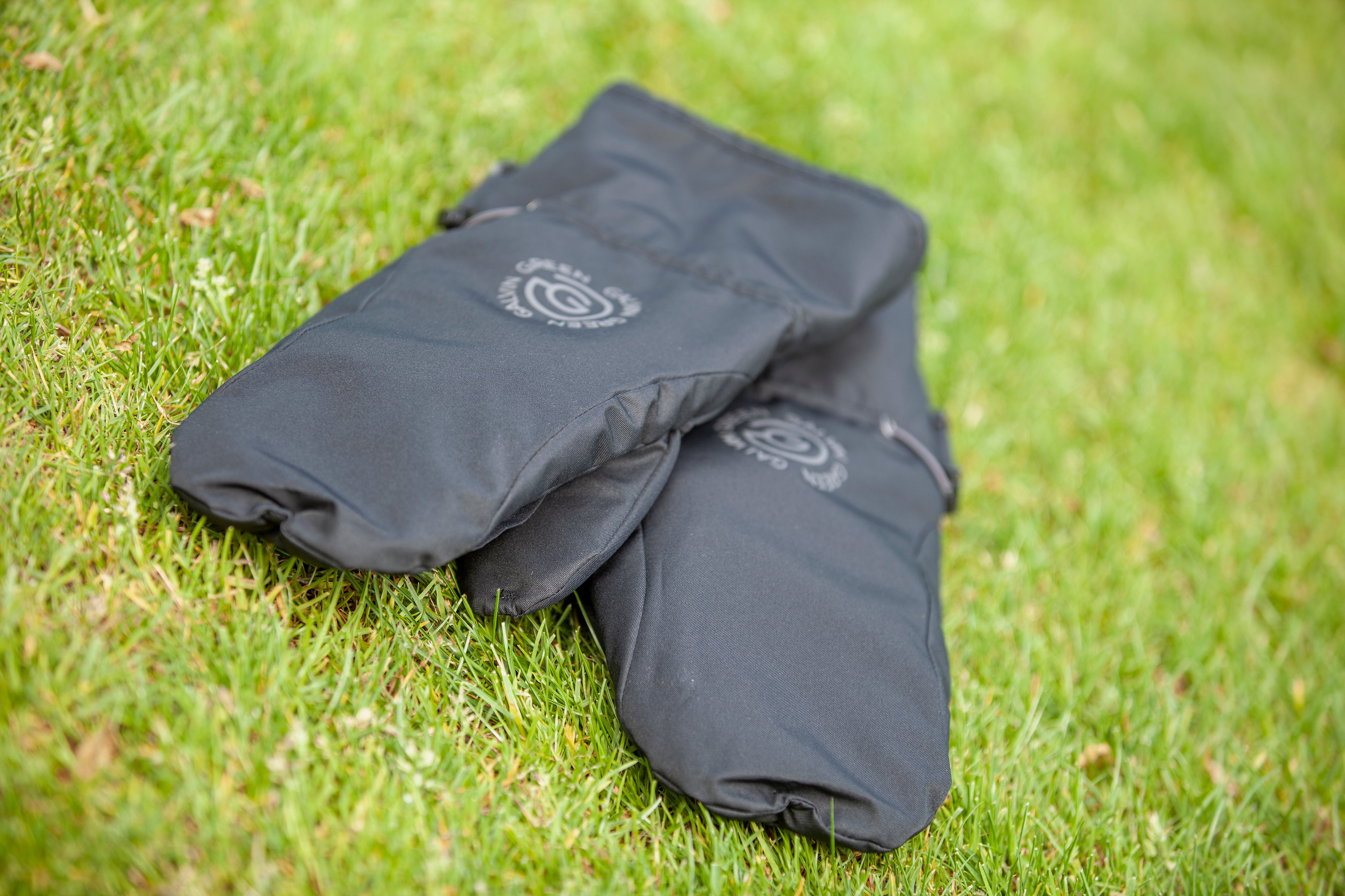 Black 'LANDON' Golf mitts in INTERFACE-1™ fabric with windproof lining.